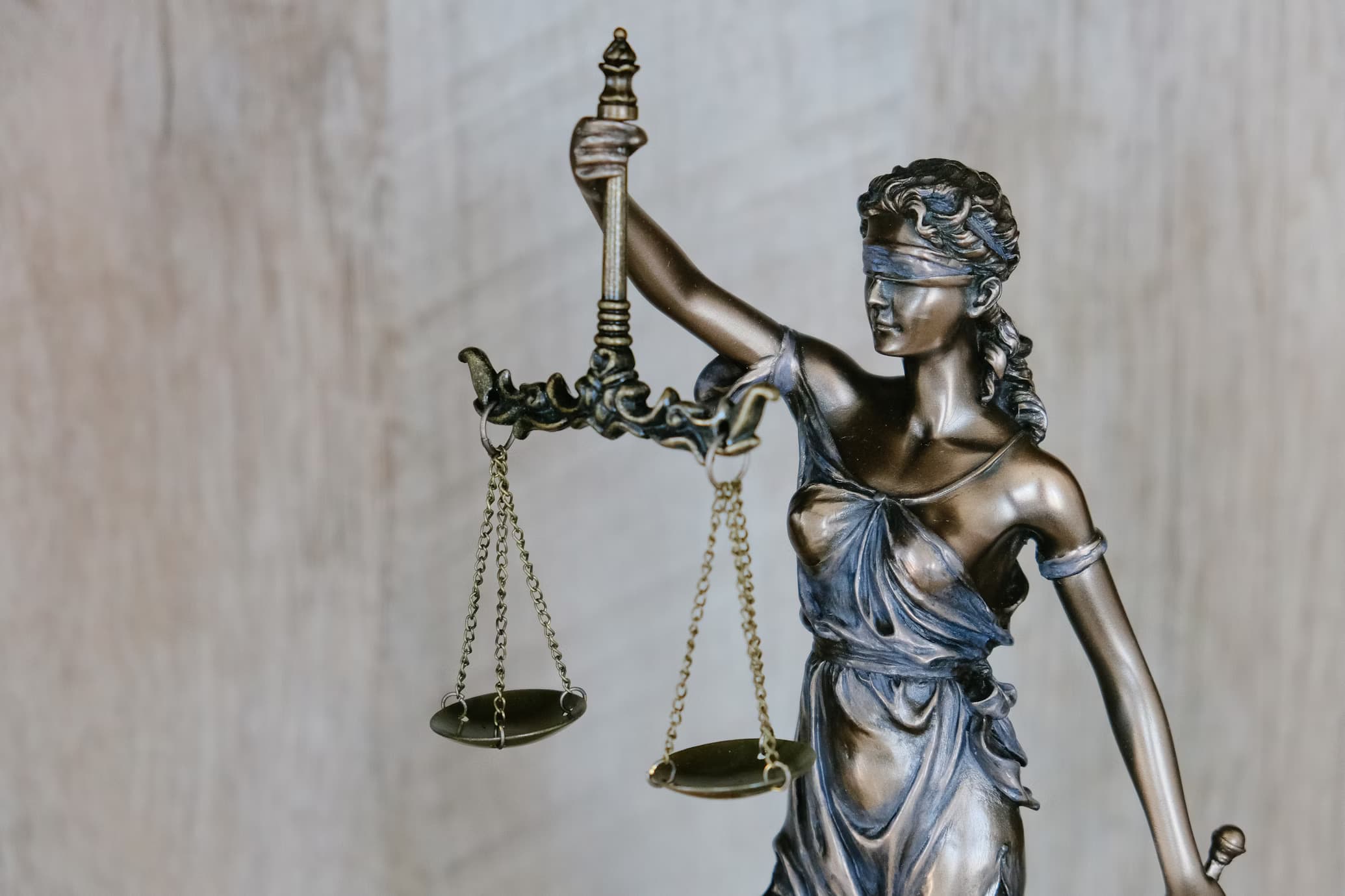 Blindfolded Lady Justice holding scales